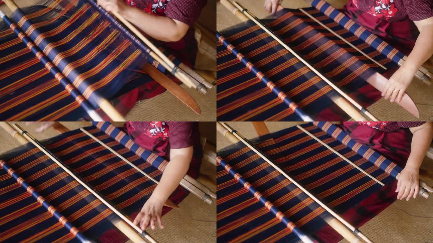 妇女手工制作传统托拉加织布纺织品Tenun特写