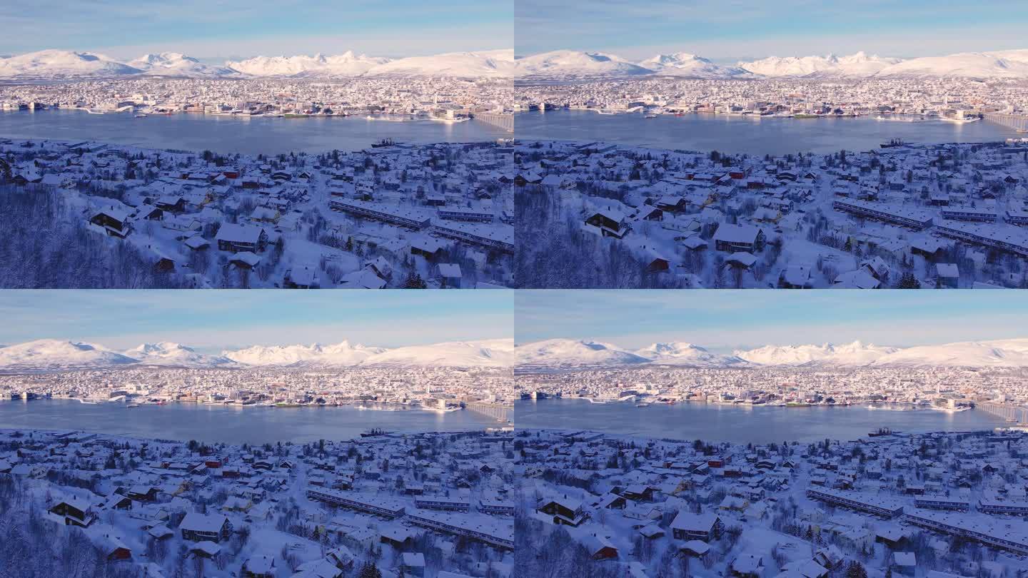 挪威特罗姆斯雪城鸟瞰图。晴朗的冬季天气
