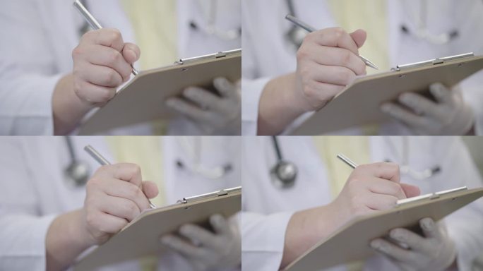图为医生在医院体检结束后，在检查室用钢笔在记事本上书写病历的特写。