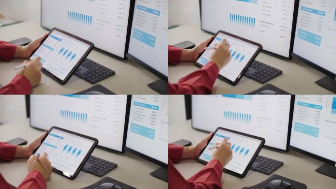 在办公室里用平板电脑和财务图表工作的女商人