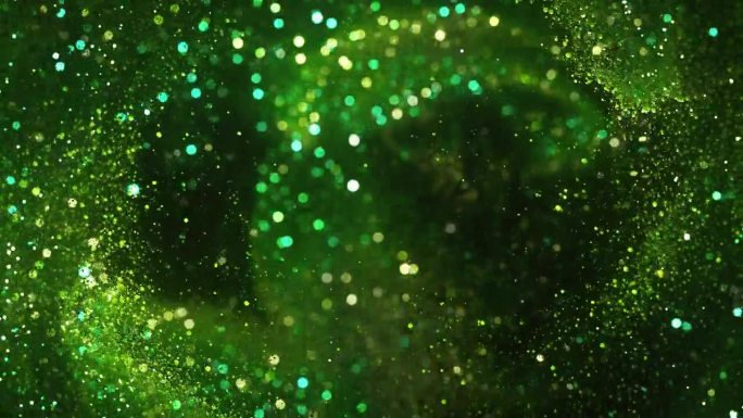 在湍流运动中闪闪发光的粒子-抽象背景，绿色-可循环