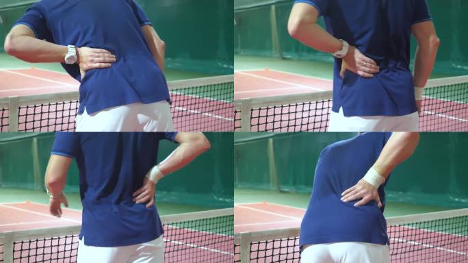 一个年轻人在硬地网球比赛中腰背部受伤。