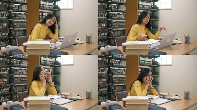 前景里的女人正在看书。年轻的亚洲女性带着紧张的情绪在现代图书馆里阅读。有教育观念的人。
