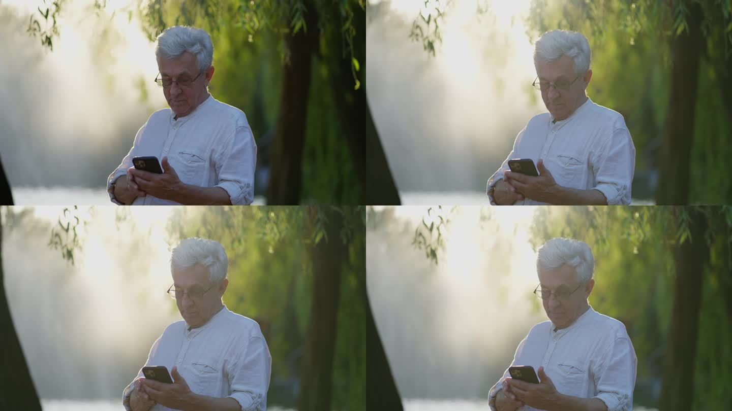 一位头发花白的老人正在看手机上的短信