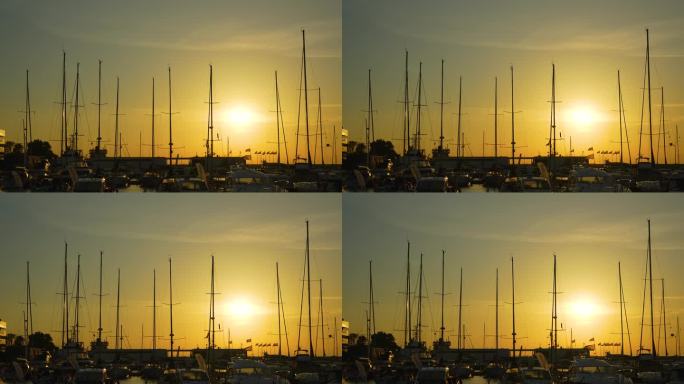 金色的夕阳照亮了停泊着帆船的码头，投下长长的影子和宁静的光芒
