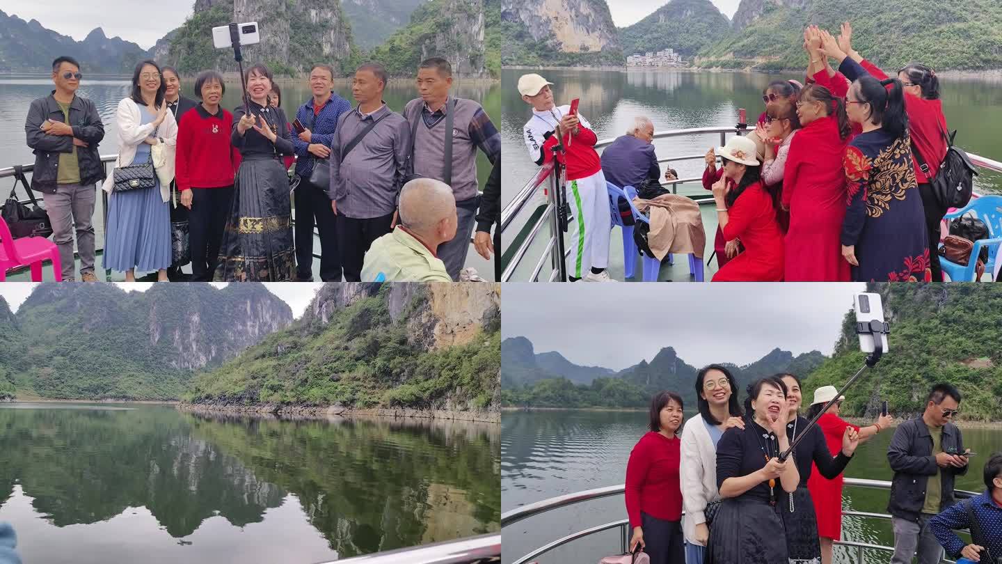 旅行社组团漓江游  游船上开心自拍的游客