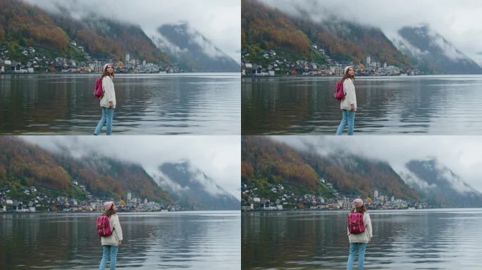 一个女人在秋天看着哈尔斯塔特湖