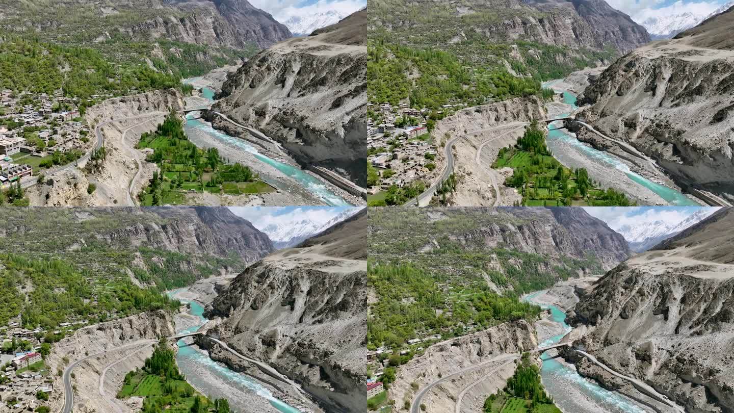 巴基斯坦北部吉尔吉特-巴尔蒂斯坦罕萨山谷的河流和喀喇昆仑山脉的空中无人机日出景观。