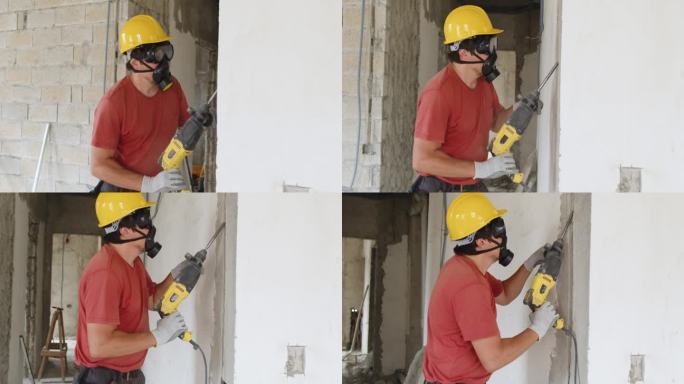 建筑工人正在用冲击钻。公寓或房子的建造、修理和翻新