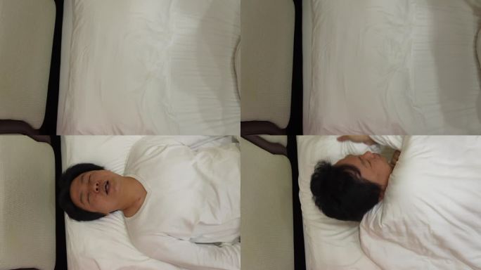 从自上而下的角度来看，一个疲惫的男人整夜在床上翻来覆去，与不安的睡眠和失眠的挑战作斗争。这种健康问题