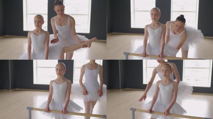 女孩在芭蕾课上把腿放在扶手上伸展