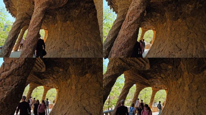 游客在欧洲西班牙巴塞罗那参观安东尼·高迪设计的gell公园。