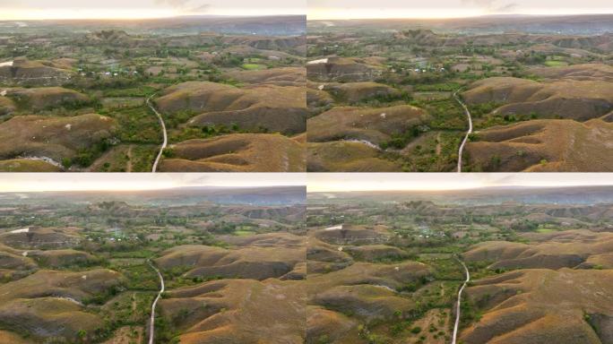 空中无人机拍摄的印尼松巴岛武吉沃林丁草地和山丘的日出景象