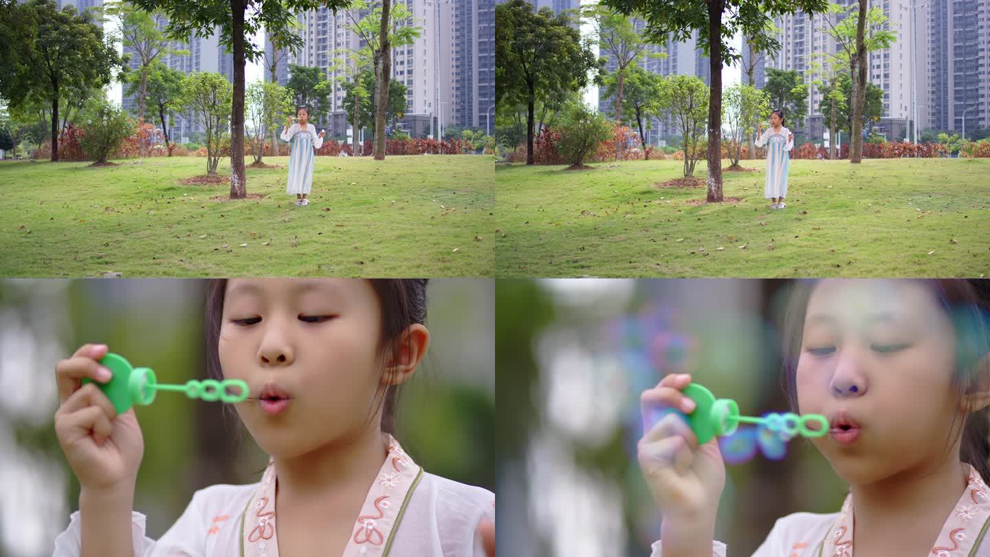 小女孩在草地上吹泡泡玩耍02
