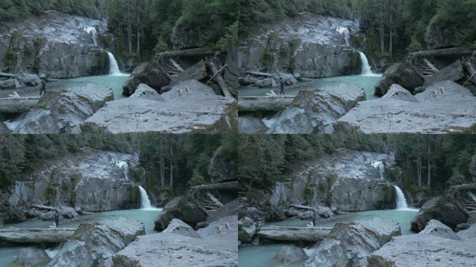 空中无人机拍摄的森林瀑布，形成天然水池