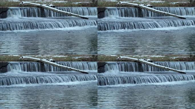瀑布从波尔德河上的导流大坝上倾泻而下，呈现出秋天的景色