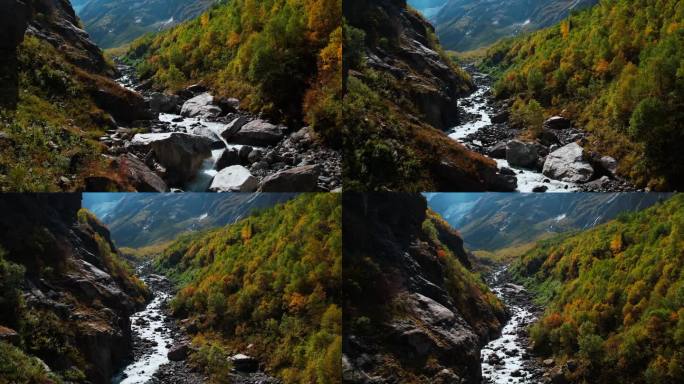 秋日的山间山谷，鸟瞰河流流过石头