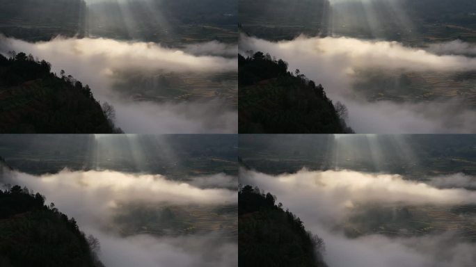 光芒万丈下的龙陵县龙江梯田风景