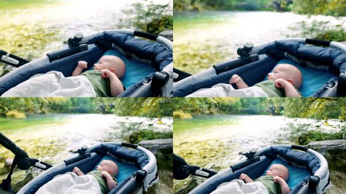 可爱的婴儿在Bohinj湖边的婴儿车里放松