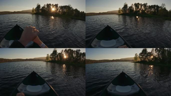 户外探险:在日落时分在湖中划独木舟