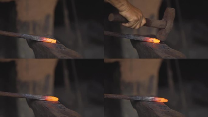 工匠正在捶打一块烧得通红的铁。