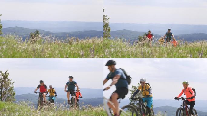 一群山地自行车手在阳光明媚的山上骑着电动自行车