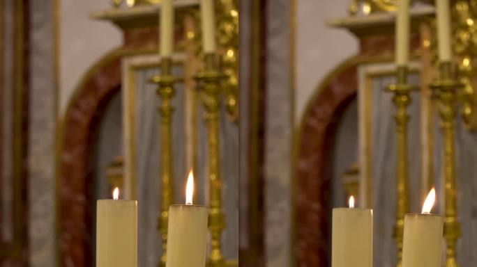 两支蜡烛在教堂的祭坛上燃烧