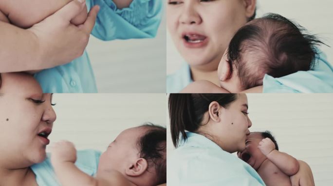 年轻的亚洲母亲在洗澡后安慰婴儿