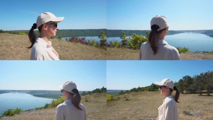 一个戴眼镜的女孩看着德涅斯特河的美丽景色。乌克兰
