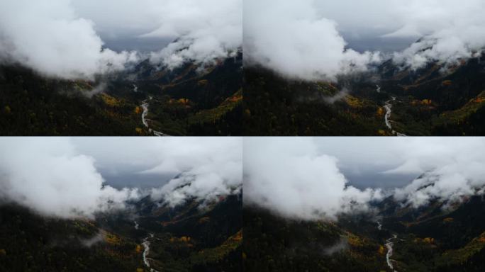 在多云阴沉的天气里鸟瞰峡谷与山谷和山脉，电影般的慢动作