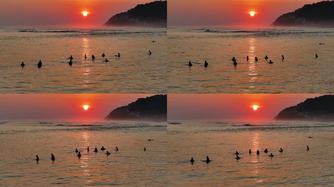 夕阳下海平面上冲浪的自由浪人