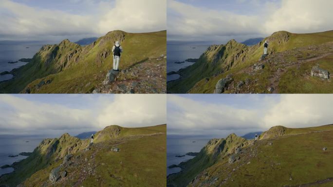 漫游癖的概念。一名男性背包客在挪威的峡湾山顶探险。