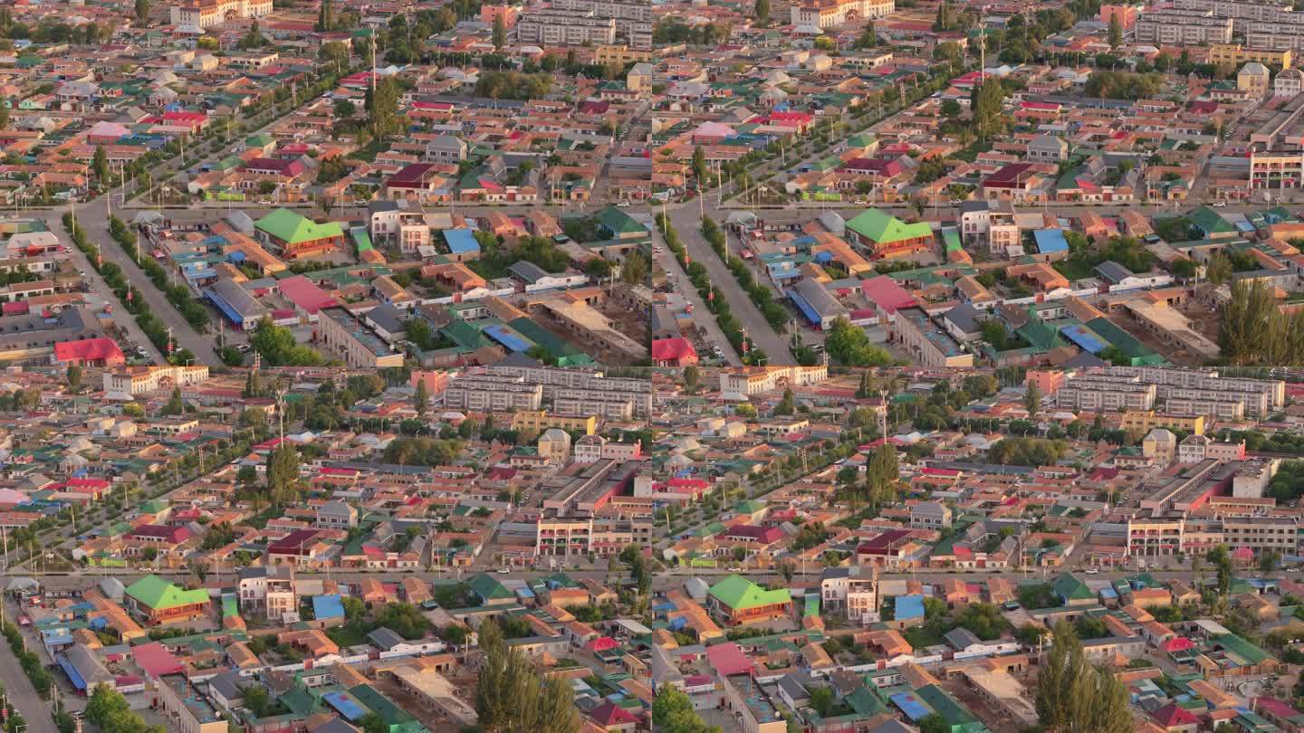 航拍清晨新疆特克斯县的彩色房子