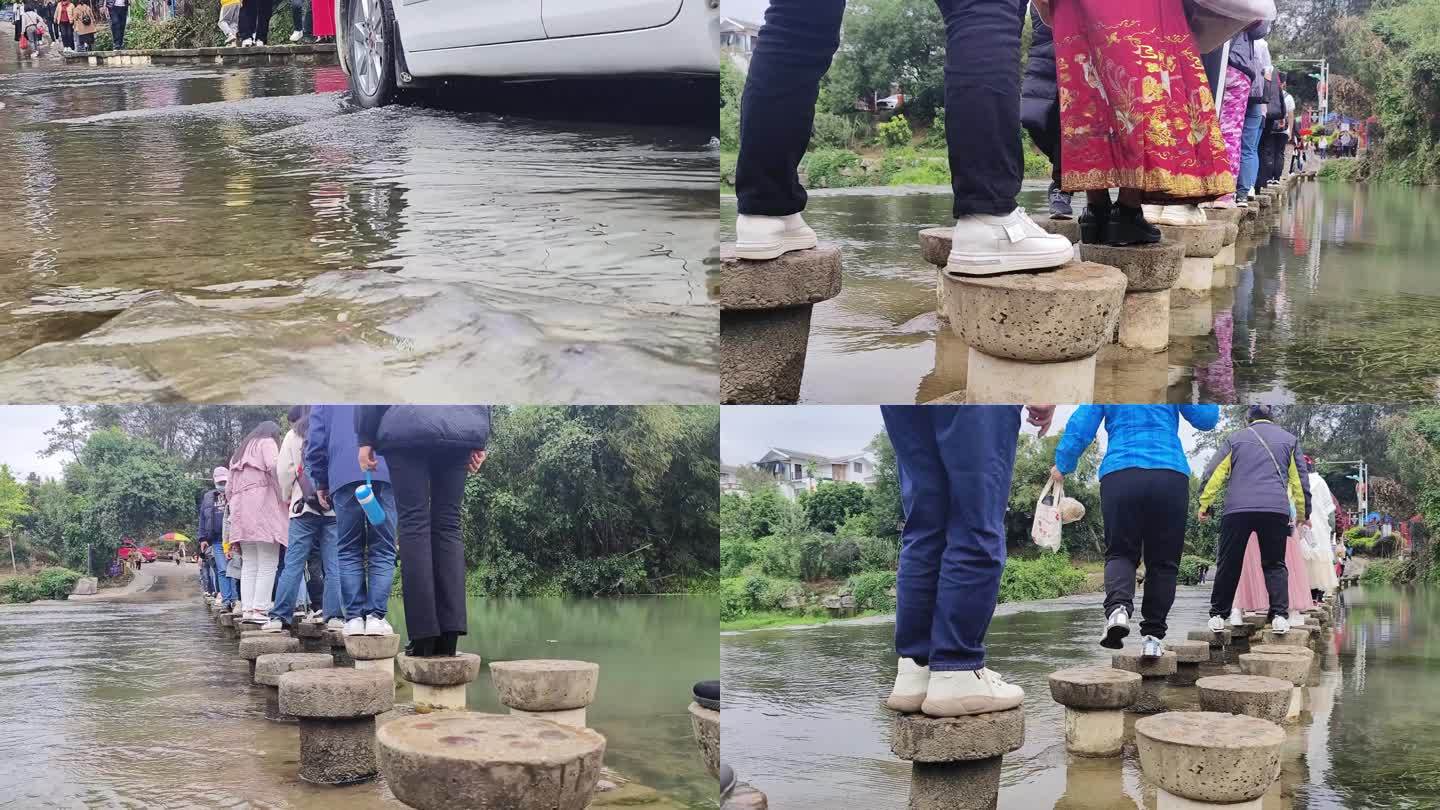 游人走过水坝河流流水游客行走过石头水坝