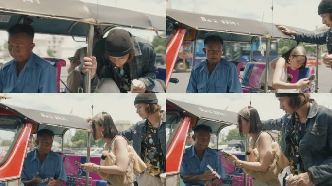 快乐的亚洲夫妇拥抱泰国文化:在曼谷的嘟嘟车冒险后通过智能手机付款。