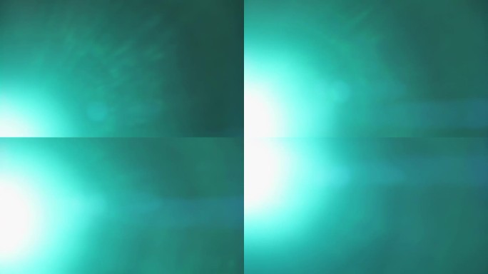 青色光线从框架左边缘的明亮光束中泄漏，在黑色背景上从下向上移动以获得叠加效果。