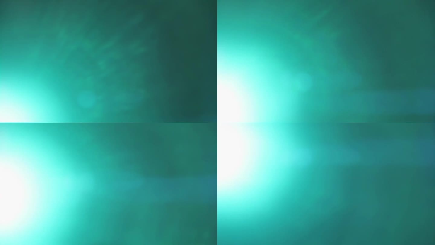 青色光线从框架左边缘的明亮光束中泄漏，在黑色背景上从下向上移动以获得叠加效果。