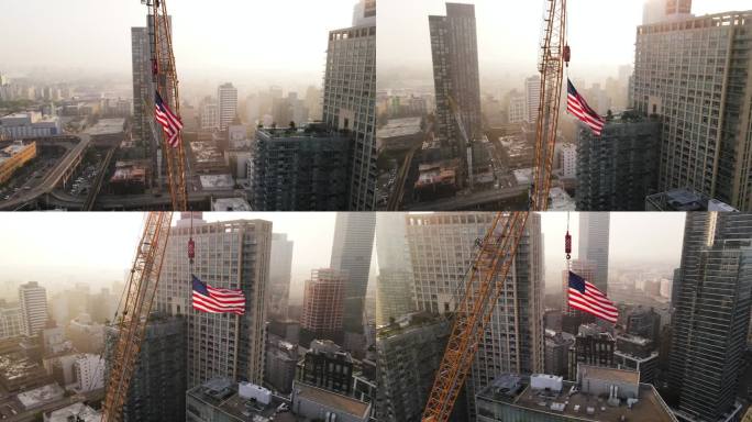 美国国旗在日出时高高飘扬在纽约上空的鸟瞰图