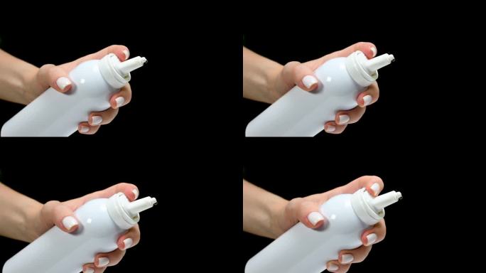 白色瓶子喷雾剂用于鼻子鼻在手