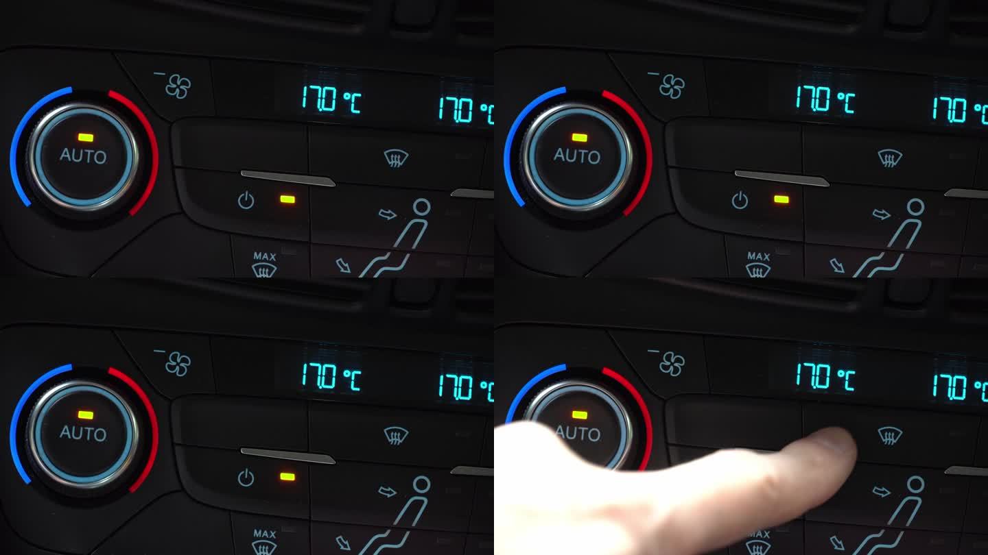 手指打开汽车空调拨动开关，开启挡风玻璃除霜模式，车内两相气候控制