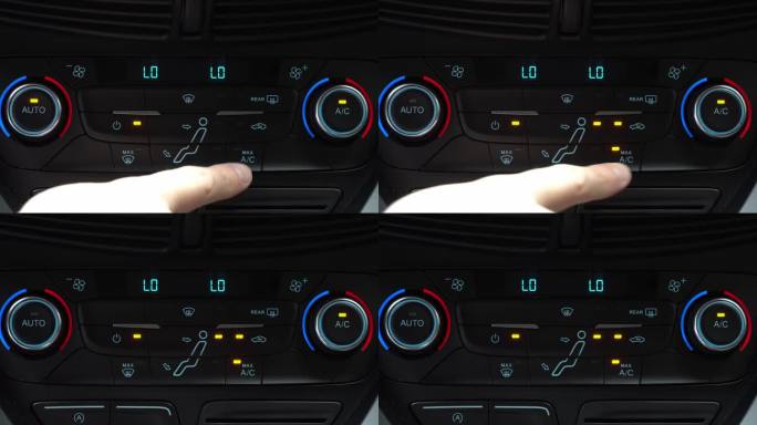 手指按下汽车多媒体面板上的最大交流气流开关，车内两相气候控制