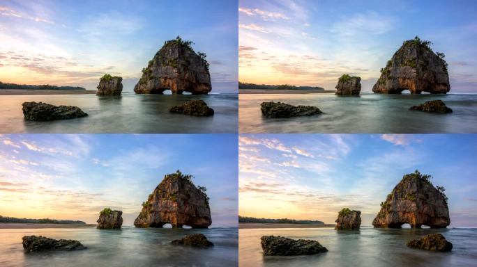 延时日出场景移动的云和岩石形成的碰撞波在Pantai Watu Malandong，西松巴，印度尼西