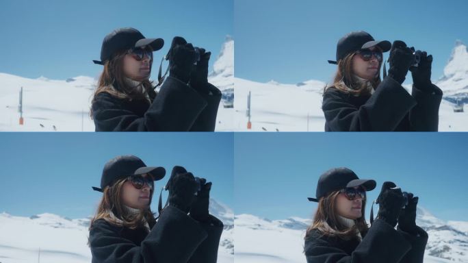 亚洲女摄影师在瑞士雪山拍摄度假照片。