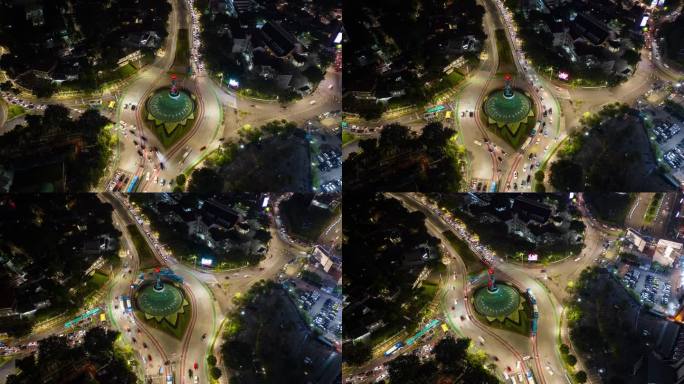 夜晚照亮雅加达市中心区交通街道广场空中俯瞰全景4k延时印尼