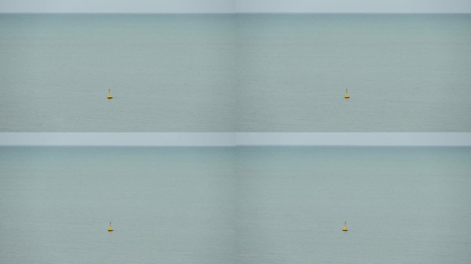 黄色标记浮标漂浮在水面上，4K场景的海上景观
