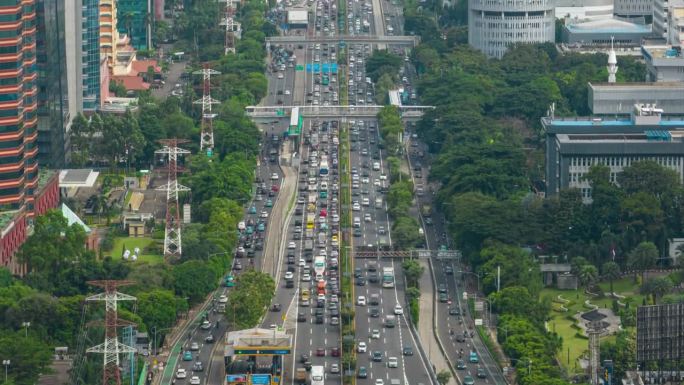 白天雅加达市高交通街道道路高峰时间航拍全景4k延时印尼