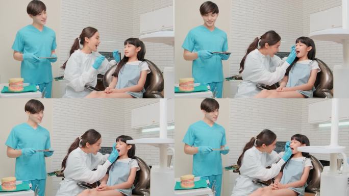 一位亚洲女牙医在牙科诊所为一位女孩检查牙齿。