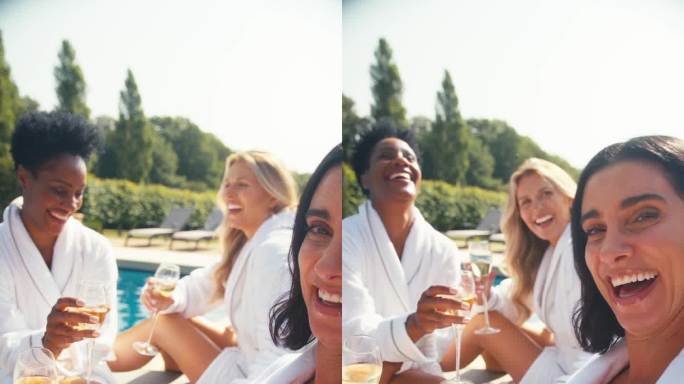 垂直视频POV拍摄的女性朋友在水疗日的躺椅上拿着香槟摆姿势自拍