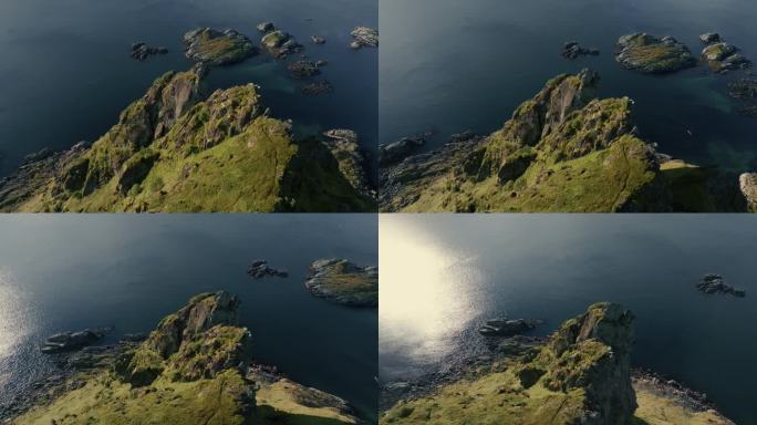 360度的绿色岩石峡湾，山峰和挪威海被阳光照亮