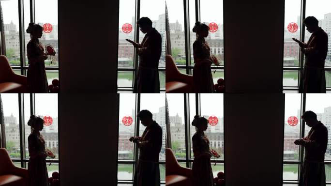 窗边中式新郎新娘剪影